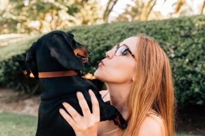 Young Woman with Her Dog in the Park – Free Stock Photo for Download