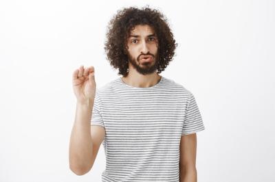 Bothered Handsome Male Model with Curly Hair and Beard in Keep Quiet Pose – Free Stock Photo, Download for Free