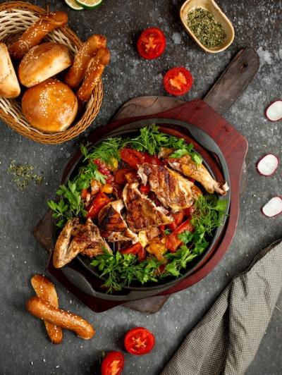 Fried Chicken with Vegetables and Herbs in an Aluminum Skillet – Free Stock Photo for Download