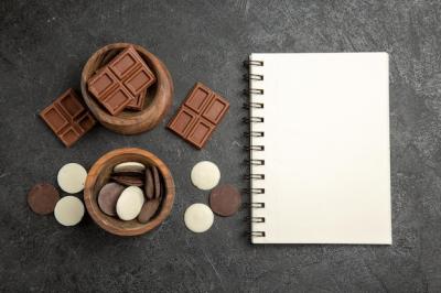 Top View of Chocolate and Bowls on Dark Background | Free Stock Photo Download