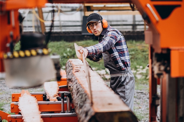 Carpenter Working on a Sawmill – Free Download