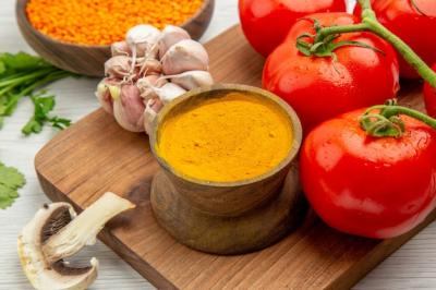 Fresh Tomato Branch with Garlic, Turmeric, and Mushrooms on Chopping Board – Free Stock Photo for Download