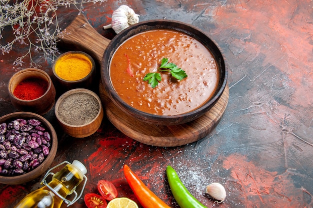 Dinner Table with Fallen Oil Bottle, Beans, Cutting Board, and Various Spices – Free Download