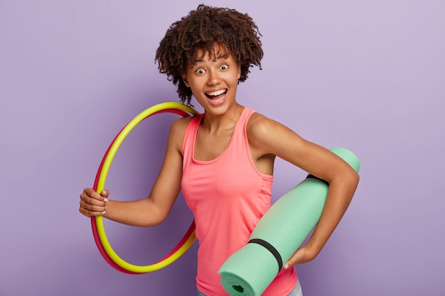 Happy Dark Skinned Girl Exercising Indoors Against Purple Wall – Free Stock Photo, Download for Free