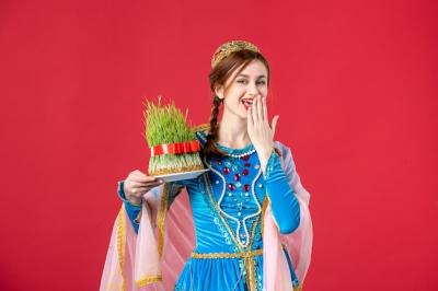 Portrait of Beautiful Azeri Woman in Traditional Dress with Semeni on Red – Free Download