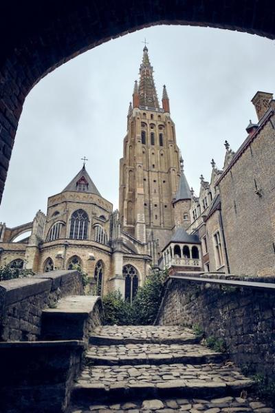 Church of Our Lady Bruges in Belgium Against a Clear Sky – Free Download