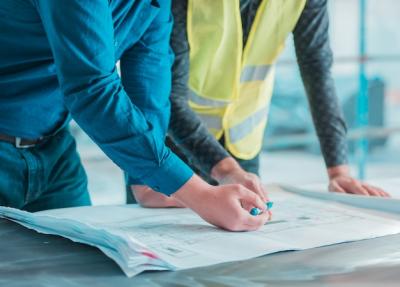 Workers Reviewing Architectural Project Plans – Free Stock Photo for Download