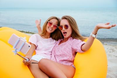 Funny Girls Taking Selfies on a Lamzac Air Sofa – Free Stock Photo for Download