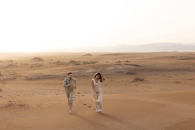 Cute Couple Walking in Desert – Free Download, Free Stock Photo