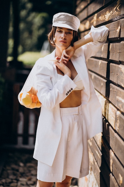 Fashionable Young Woman with Apricots – Free Stock Photo for Download