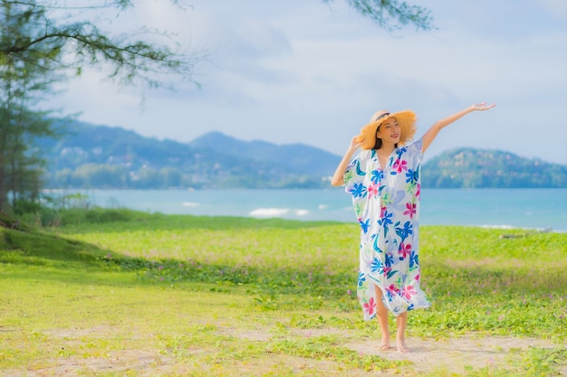 Beautiful Young Asian Woman Relaxing at the Beach – Free Stock Photo for Download