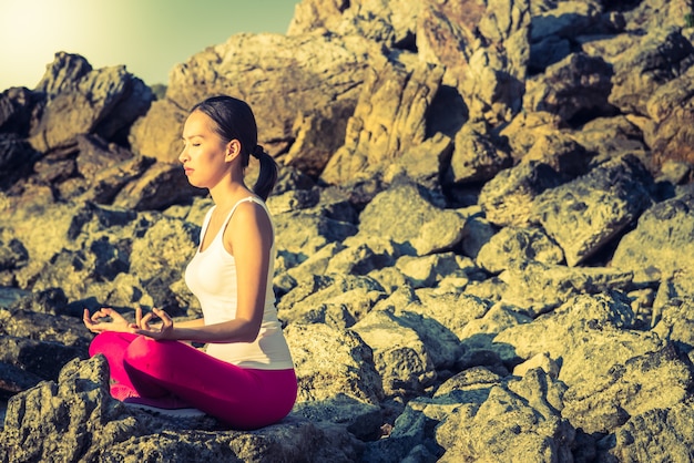 Young Woman Practicing Yoga on the Beach – Free to Download