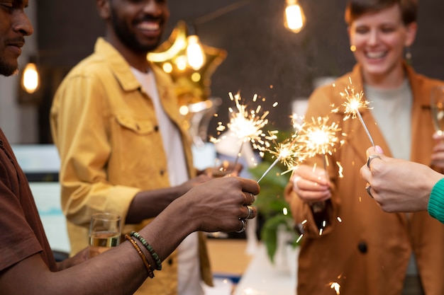 Close Up Happy Colleagues Celebrating with Fireworks – Free Download