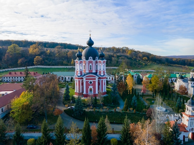 Drone View of Curchi Monastery Surrounded by Greenery and Hills – Free Download