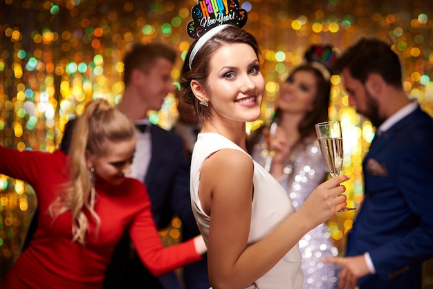 Attractive Woman Holding a Glass of Champagne – Free Stock Photo Download