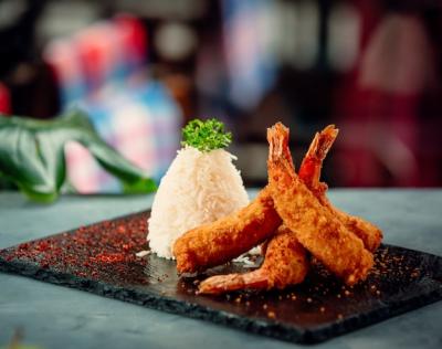 Crispy Fried Shrimps with Rice on Black Stone Board – Free Download