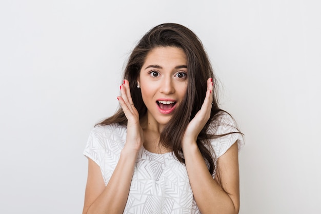 Surprised Woman in White Blouse Expressing Joy – Free Download