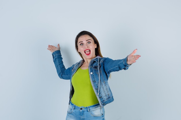 Beautiful Young Woman in Denim Outfit Ready for a Hug – Free Stock Photo, Download for Free