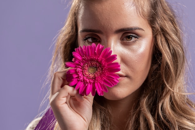 Woman Holding a Flower Near Her Face – Free Stock Photo, Download for Free