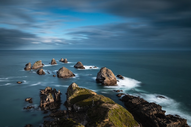 Big Rocks in the Sea Under a Blue Cloudy Sky – Free Stock Photo, Download Free