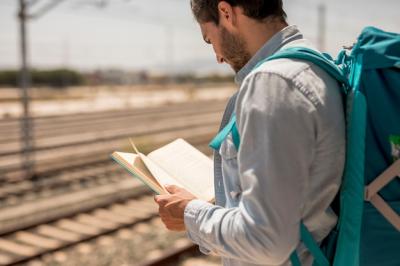 Back View of a Man Reading a Book – Free Download