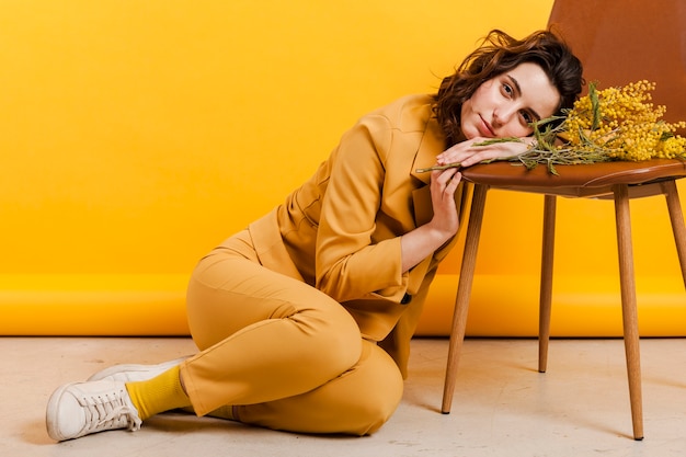 High Angle Shot of a Woman Resting Her Head on a Chair – Free Download