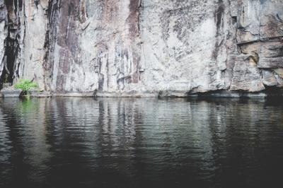 Stunning Rocky Cliff by a Tranquil Lake – Free Stock Photo, Download for Free