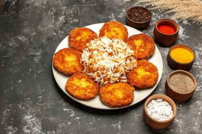 Delicious Fried Cutlets with Cooked Rice and Seasonings – Free Stock Photo, Download for Free