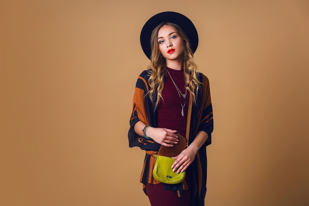 Portrait of a Young Blonde Woman in Brown Straw Poncho and Stylish Accessories – Free Stock Photo for Download