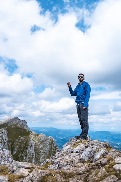 Vertical Shot of a Man on Aitzkorri Mountain in Gipuzkoa – Free Stock Photo for Download