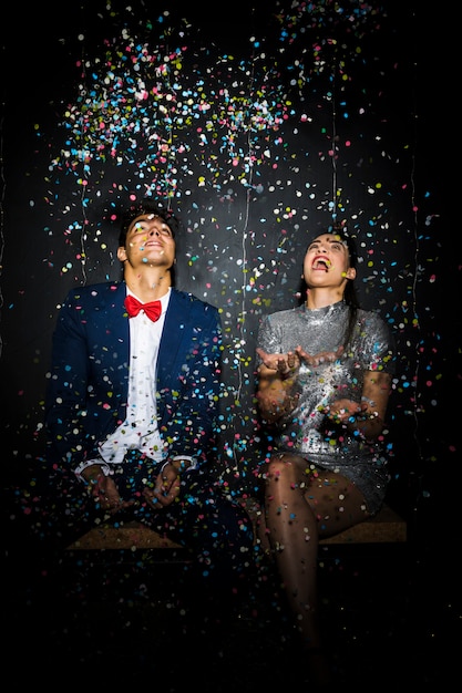 Beautiful Couple Celebrating with Confetti – Free Stock Photo for Download