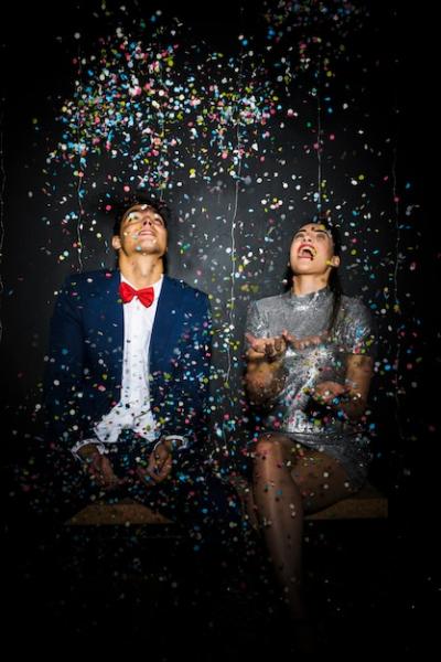 Beautiful Couple Celebrating with Confetti – Free Stock Photo for Download