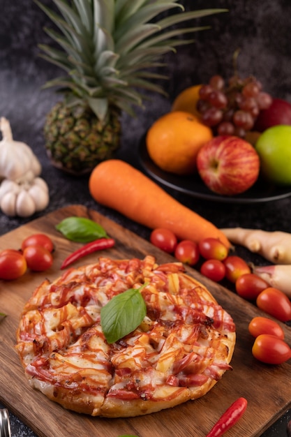 Delicious Pizza in a Wooden Tray with Tomatoes, Chili, and Basil – Free Download