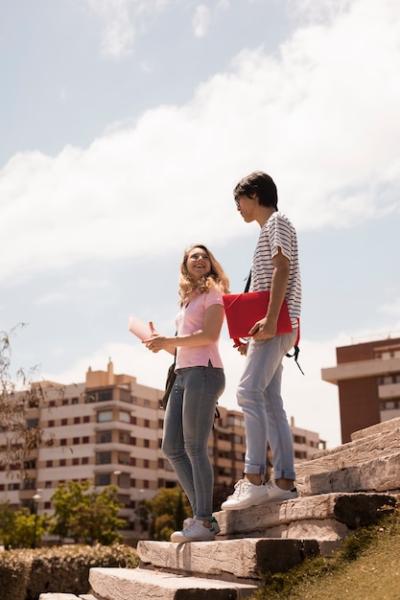 Young Teen Couple on Stairs Against Cityscape – Free Stock Photo, Download Free