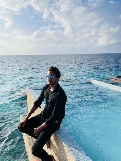 Man in Black on a Wooden Jetty in the Maldives – Free Stock Photo Download