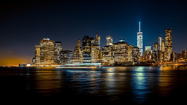 Stunning Nighttime Urban Cityscape with Boat – Free Download