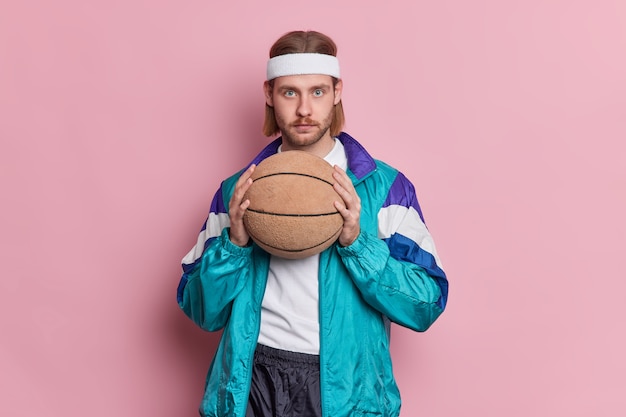 Serious Basketball Player With Blue Eyes and Long Hair – Free Stock Photo for Download