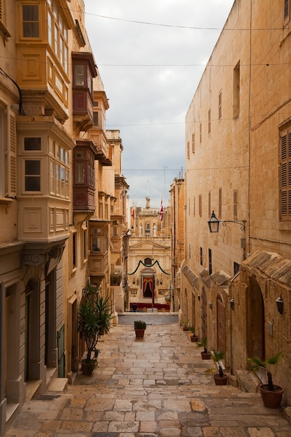 Explore the Charm of a Street in Old Valletta – Free to Download Stock Photo