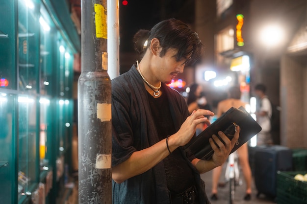 Nightlife in the City: Young Person Enjoying the Vibrant Atmosphere – Free Stock Photo Download