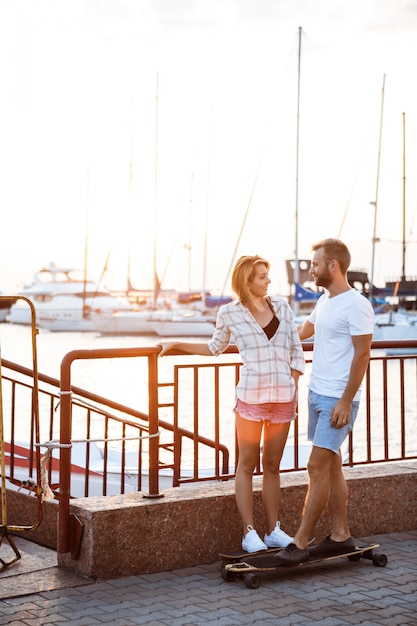 Young Beautiful Couple Skateboarding by the Seaside – Free Stock Photo for Download