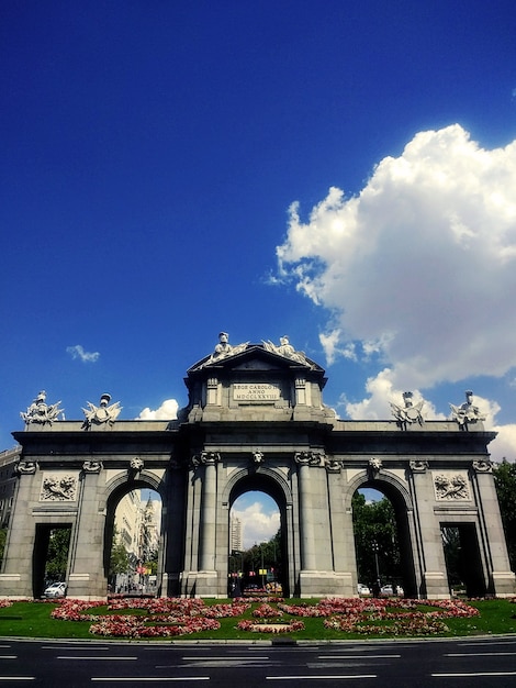 Neoclassical Monument Puerta de Alcala in Madrid Under a Blue Sky – Free Download