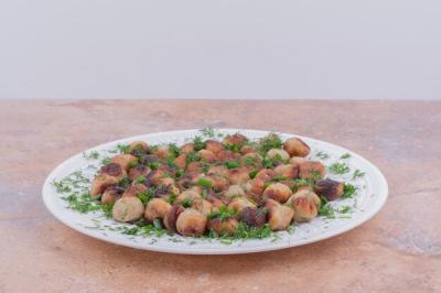 Delicious Meat Stuffings Served on a White Plate with Fresh Herbs – Free Download