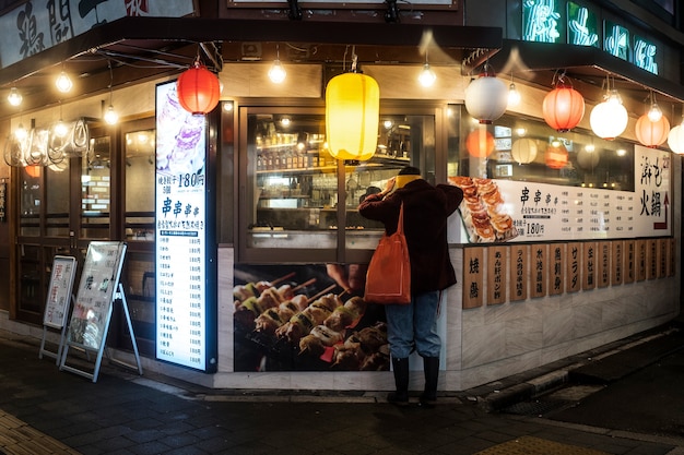 Customer Enjoying Japanese Street Food – Download Free Stock Photo