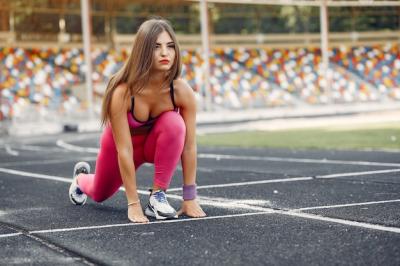 Sports Girl in Pink Uniform Running at the Stadium – Free Stock Photo, Download for Free