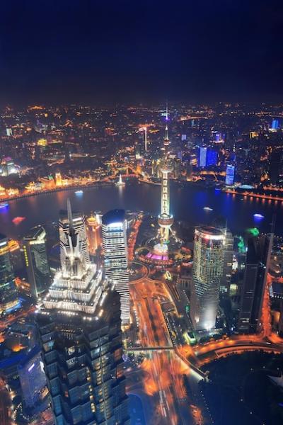 Stunning Aerial View of Shanghai City at Night with Lights and Urban Architecture – Free Download