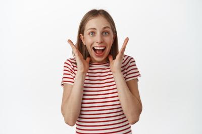 Excited and Surprised Young Woman Celebrating Great News – Free Download