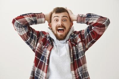 Troubled Man in Panic Grabbing Head and Screaming Distressed – Free Stock Photo for Download