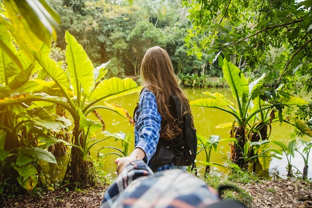 Couple Holding Hands Walking into a Forest – Free Stock Photos, Download for Free