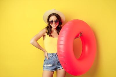 Beach Girl Enjoying Summer Vacation with Swimming Ring – Free Download