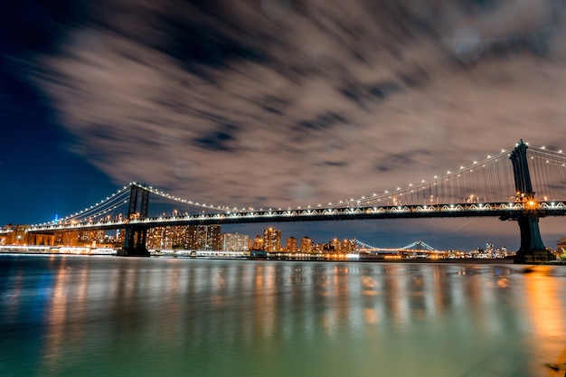 Stunning Night View of Brooklyn Bridge with Reflections on Water – Free Stock Photo, Download for Free